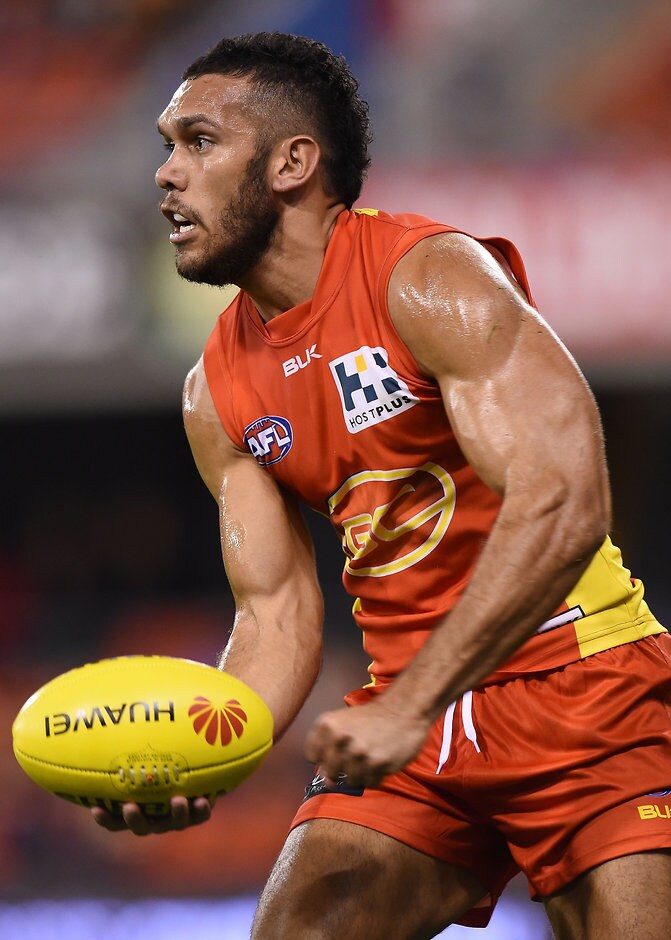 AFL 2015 Rd 18 - Gold Coast v West Coast GOLD COAST, AUSTRALIA - AUGUST 1: Harley Bennell of the Suns handballs during the 2015 AFL round 18 match between the Gold Coast Suns and the West Coast Eagles at Metricon Stadium, Gold Coast, Australia on August 1, 2015. (Photo by Matt Roberts/AFL Media)